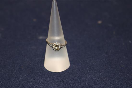 A diamond solitaire ring, the old-cut diamond approx 1.0ct, with diamond-set shoulders on white gold shank, size O.